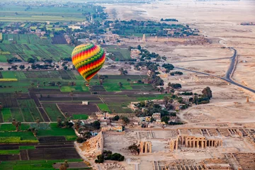 Poster Aerial view of beautiful hot air balloon flying over the ruins Temple of the Ramesseum. © takepicsforfun