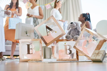 Babies are always blessings. Shot of a group of women holding a sign at a friends baby shower. - obrazy, fototapety, plakaty