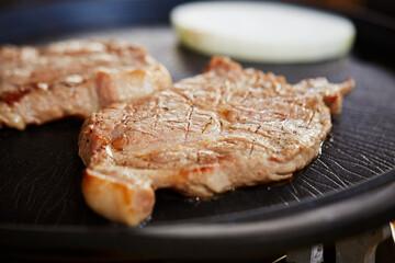Meat and vegetables cooked in a cast iron pan