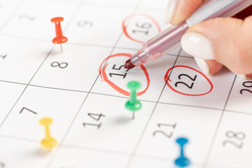 Calendar marks date with red marker. business meeting appointment date 15th day of the month