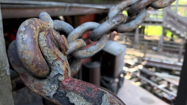 Rusty chain close-up against metal background. High quality 4k footage