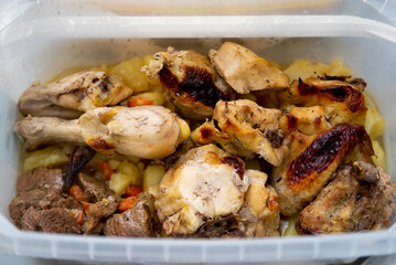 chicken cooking. slices of meat on a baking sheet