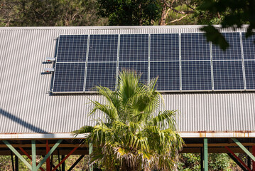 solar panels on a rooftop red barn