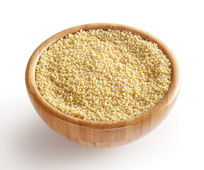 Uncooked dried cous cous in wooden bowl isolated on white background with clipping path