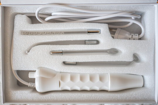 New electric Darsonval in white box in beauty parlor