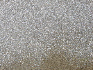 Snow ice texture. Thawed frost on a wooden board. wooden planks cowered with melting snow. Winter...