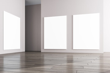 Modern concrete gallery interior with wooden flooring and blank white mock up frames on wall. Museum and exhibition hall concept. 3D Rendering.