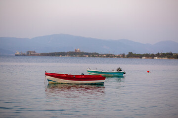 Fototapeta na wymiar Summer. Boats on the coast. Sea. Lobs in the ocean. Rest on boats. Fishing in the sea. Embankment
