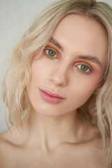 beauty portrait of blonde natural woman with soft fresh colorful make-up