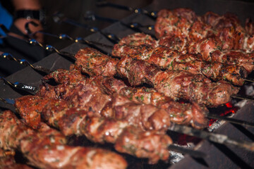 Shish kebab is fried on charcoal grill.