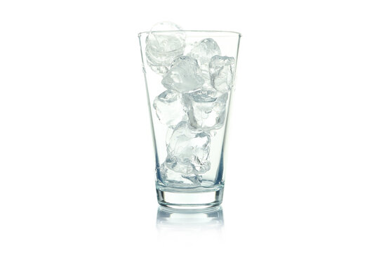 Glass with ice cubes isolated on white background