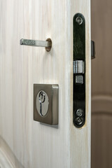 Naklejka premium Door lock prepared for handle installation. Repair and installation of door locks.