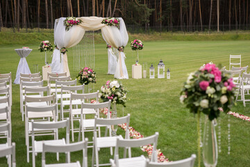 football field wedding ceremony white chairs