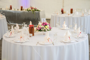 white wedding tent hall decor from paper balls and floristry