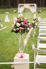 flower arrangement in a vase football field wedding ceremony