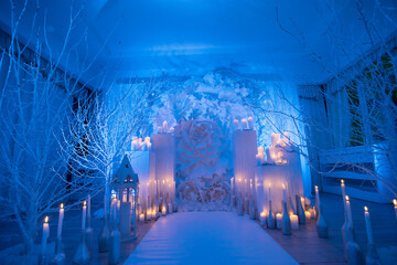 winter wedding ceremony inside the restaurant blue light