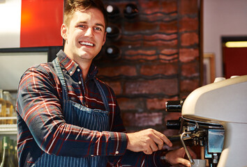 We dont sell mediocre coffee here. Portrait of a barista operating a coffee machine in a cafe. - obrazy, fototapety, plakaty