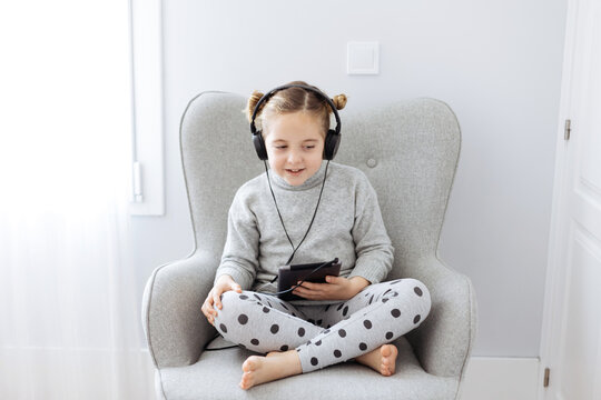 Girl in headphones listening to music