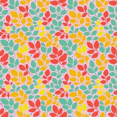 Colorful seamless pattern with orange, green and red leaves on the light pink background