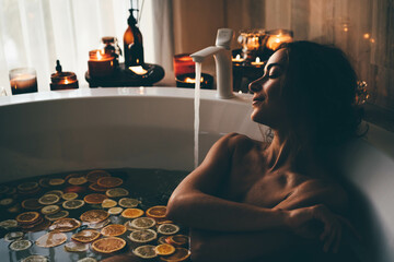 Beautiful woman relaxing at spa. Young lady relaxing in jacuzzi.