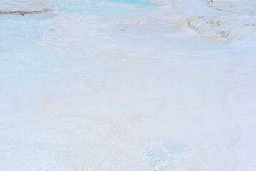 Beautiful nature background with white limestone close up on terraces with thermal water. Soft selective focus. Beauty of nature. Health and wellness concept