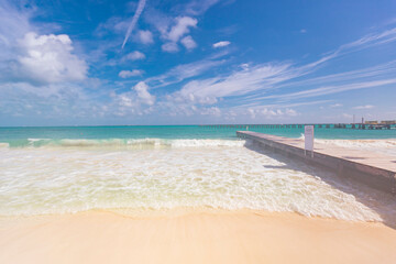 Cancun Mexico beautiful caribbean sea on a sunny day and cloudy sky. sandy beach