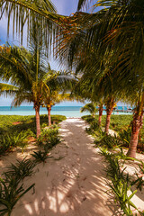 Fototapeta na wymiar Cancun Mexico beautiful caribbean sea on a sunny day and cloudy sky. Sandy beach