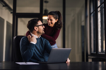 Portrait of a lovely couple, at the workplace.
