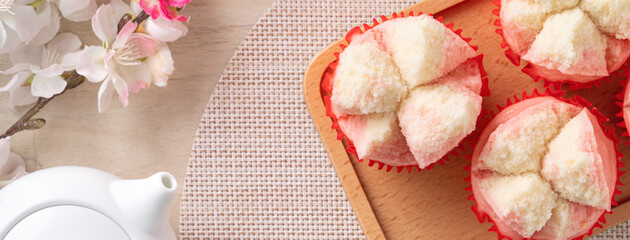 Cute Chinese steamed sponge cake - Fa Gao on wooden table background for spring festival celebration food.