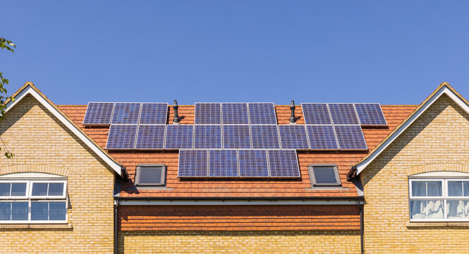 Solar Panels On The Roof Of A New Build Home. UK.
