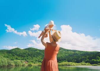 Mother and baby. Concept of natural maternity and motherhood. Beautiful woman and little baby happy...