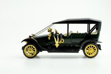 Small toy retro car on a light background.