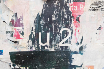 Peeled street posters background with letters and numbers