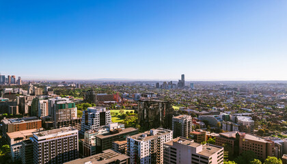 Fototapeta na wymiar Aerial view of Melbourne cityscape with skyline against blue sky.