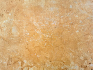 Old cracked vintage brown concrete wall texture background.