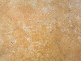 Old cracked vintage brown concrete wall texture background.