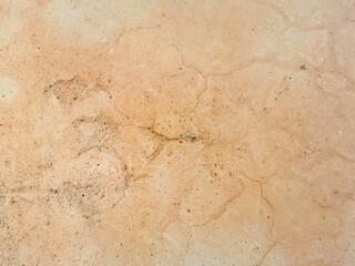 Old cracked vintage brown concrete wall texture background.