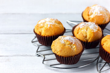 Vanilla muffins on a cooling rack.