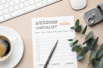 Flat lay composition with Wedding Checklist on white wooden table