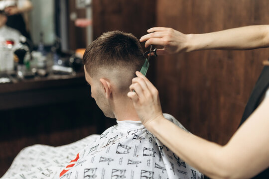 Man Getting His Hair Cut At Barbershop