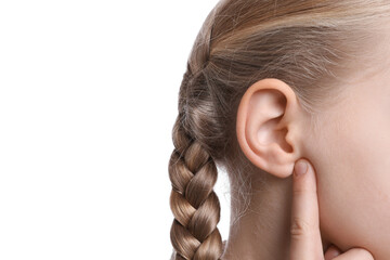 Cute little girl pointing at her ear on white background, closeup