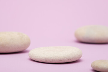 Obraz na płótnie Canvas abstract white stones on pink background, stone podium, presentation platform
