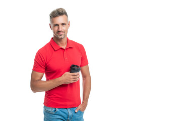 Happy man in casual red tshirt holding takeaway coffee cup isolated on white