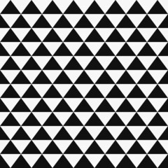 Black and white chess triangles. A vector of identical black triangles on a white canvas. Vector decor with triangles.