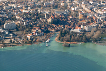 Naklejka premium Aerial sunrise view of Annecy lake waterfront and old town with landmarks, France