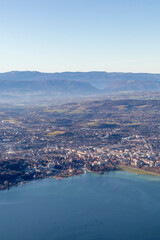 Fototapeta premium Aerial sunrise view of Annecy lake waterfront and old town with landmarks, France