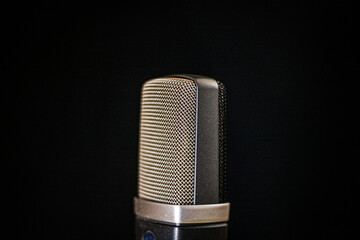 Condenser microphone texture on a black background