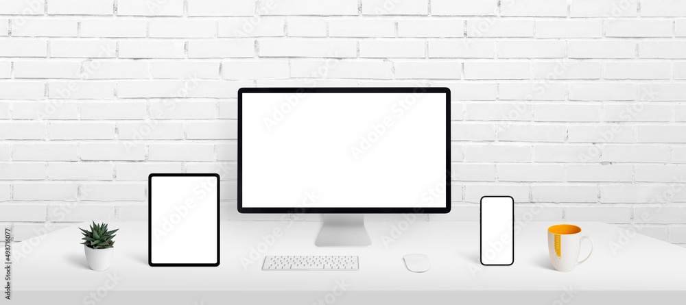 Fototapete Responsive devices display mockup on work desk. Computer display, smart phone and tablet on work desk with isolated screen for app or web page presentation