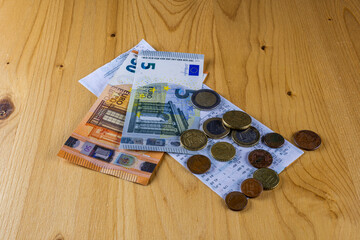 catering restaurant concept of cash receipt with euro cash money on a brown table background
