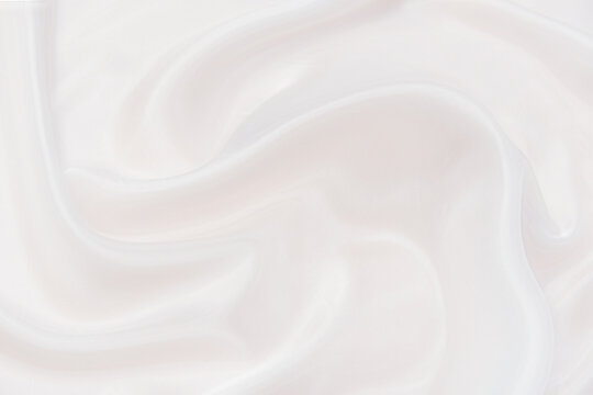 Abstract and soft focus wave of white or ivory fabric background, white ivory texture and detail